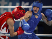 Maksym Halinichev of Ukraine, right, competes Oct. 18, 2018, against Abdumalik Khalokov of Uzbekistan in the Boxing Men&rsquo;s Bantam (56kg) Gold Medal Bout at the Oceania Pavilion of Youth Olympic Park during the Youth Olympic Games in Buenos Aires, Argentina. As one of Ukraine&rsquo;s most promising boxing prospects, Halinichev could have been shielded from the war.