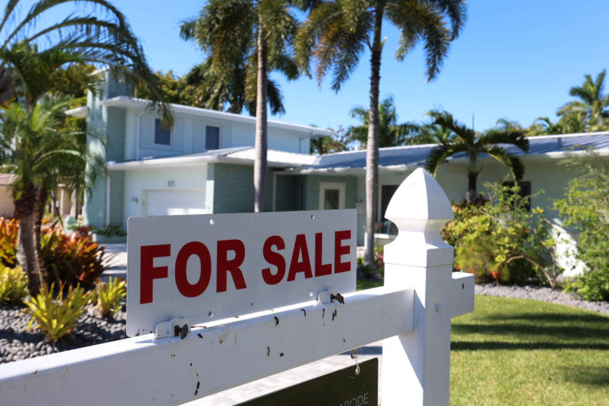 A &ldquo;For Sale&rdquo; sign is posted in front of a single-family home on Oct. 27, 2022, in Hollywood, Florida.