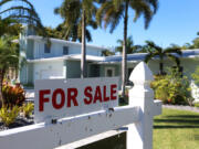 A &ldquo;For Sale&rdquo; sign is posted in front of a single-family home on Oct. 27, 2022, in Hollywood, Florida.