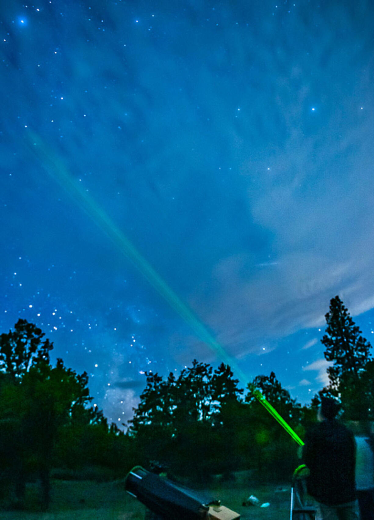 Michael McKeag uses a laser pointer during a night-sky presentation in Hood River, Ore.