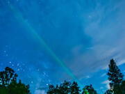 Michael McKeag uses a laser pointer during a night-sky presentation in Hood River, Ore.