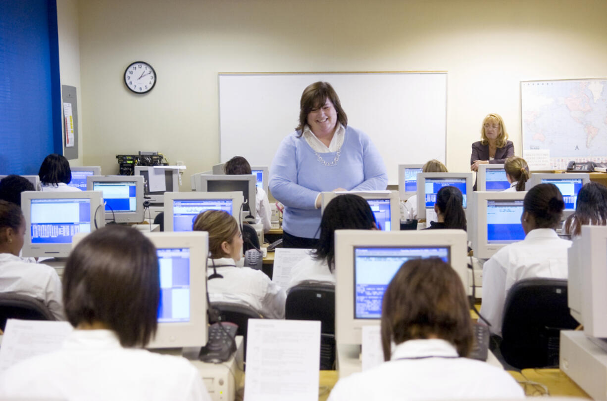 Lynn Rullman, daughter of International Air and Hospitality Academy founder Arch Miller, teaches a class in 2008.