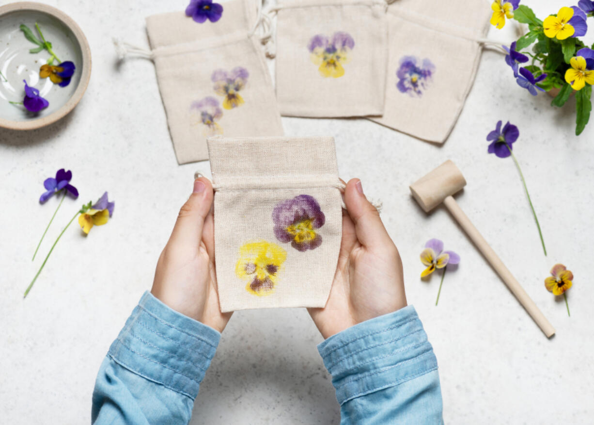 Pounding flowers onto fabric or paper is a fun and easy way to create art and preserve the beauty of garden flowers.