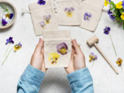 Pounding flowers onto fabric or paper is a fun and easy way to create art and preserve the beauty of garden flowers.