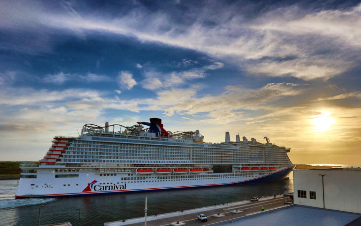 The Carnival Cruise Line ship Mardi Gras docks at Terminal 3 at Port Canaveral, Florida, early Friday morning, June 4, 2021. The brand new ship has a capacity of 6,500 passengers and 20 decks, making it the eighth largest cruise ship in the world. The Mardi Gras is also the first ship in North America powered entirely by liquefied natural gas.