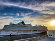 The Carnival Cruise Line ship Mardi Gras docks at Terminal 3 at Port Canaveral, Florida, early Friday morning, June 4, 2021. The brand new ship has a capacity of 6,500 passengers and 20 decks, making it the eighth largest cruise ship in the world. The Mardi Gras is also the first ship in North America powered entirely by liquefied natural gas.