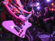 Former Nirvana bassist Krist Novoselic performs at the Belltown Yacht Club in Seattle on July 11, 2024. Novoselic chairs the startup Cascade Party, which aims to provide a centrist alternative.