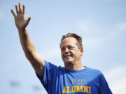 Actor Vince Vaughn waves to fans as he walks onstage during driver pre-race ceremonies prior to the NASCAR Cup Series South Point 400 at Las Vegas Motor Speedway on Oct. 16, 2022, in Las Vegas, Nevada.