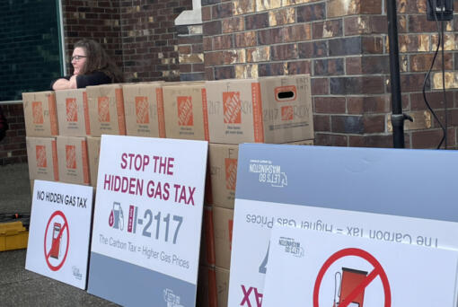 Let&rsquo;s Go Washington, a political committee, turned in boxes of petitions for Initiative 2117 (above) and five other initiatives in the fall of 2023. A supporter rests before helping deliver them to the secretary of state&rsquo;s office.