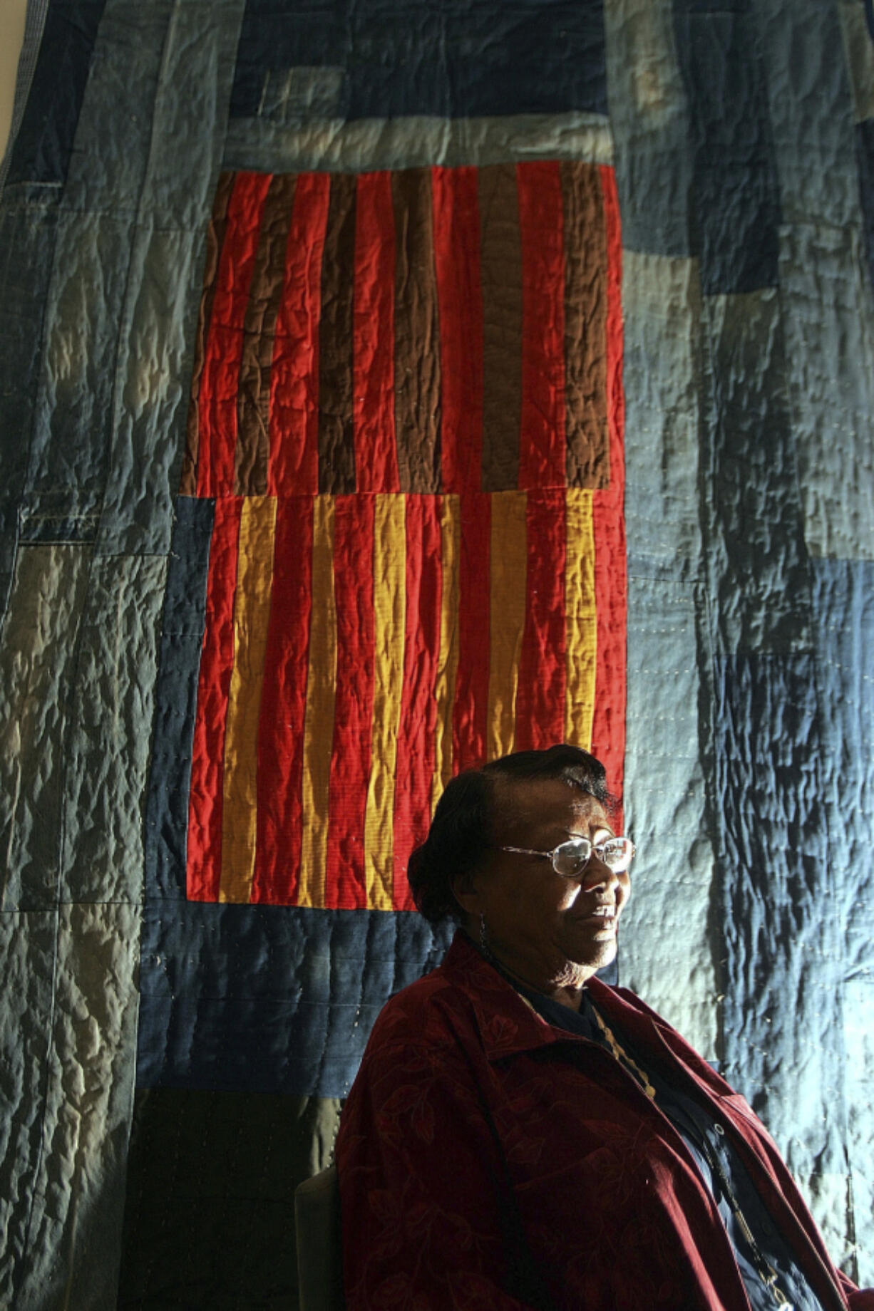 FILE - Quilter Annie Mae Young, of the Gee&rsquo;s Bend area in Alabama, poses in front of her quilt at the Museum of Fine Arts in Boston, May 31, 2005. Target launched a limited-edition collection based on the Gee&Ccedil;&fnof;&Ugrave;s Bend quilters&rsquo; designs for Black History Month in 2024. The Target designs were &Ccedil;&fnof;&uacute;inspired by&Ccedil;&fnof;&ugrave; five Gee&rsquo;s Bend quilters who reaped limited financial benefits from the collection&Ccedil;&fnof;&Ugrave;s success.