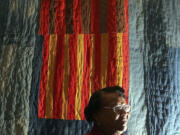 FILE - Quilter Annie Mae Young, of the Gee&rsquo;s Bend area in Alabama, poses in front of her quilt at the Museum of Fine Arts in Boston, May 31, 2005. Target launched a limited-edition collection based on the Gee&Ccedil;&fnof;&Ugrave;s Bend quilters&rsquo; designs for Black History Month in 2024. The Target designs were &Ccedil;&fnof;&uacute;inspired by&Ccedil;&fnof;&ugrave; five Gee&rsquo;s Bend quilters who reaped limited financial benefits from the collection&Ccedil;&fnof;&Ugrave;s success.