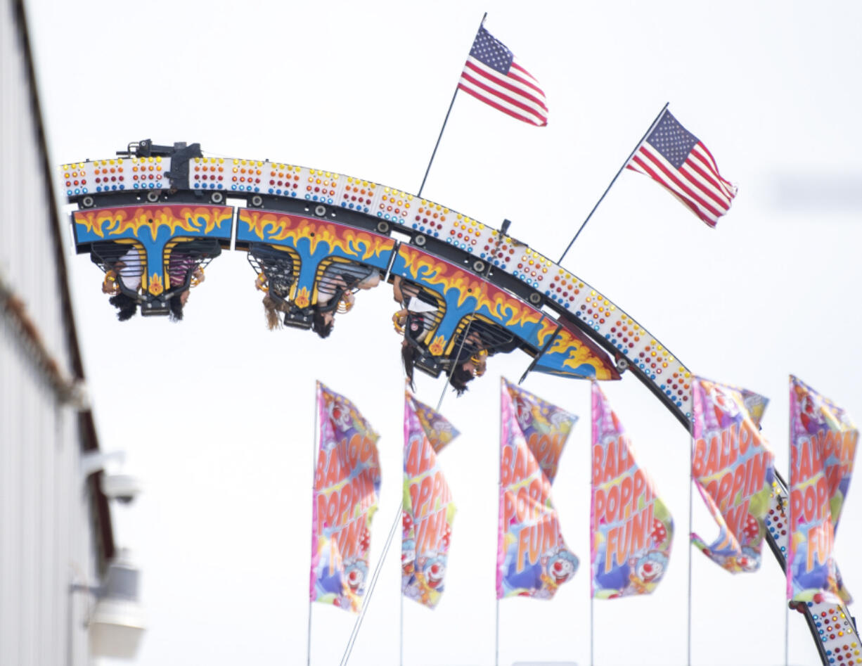 People ride the Ring of Fire ride in 2023 at the Clark County Fair.