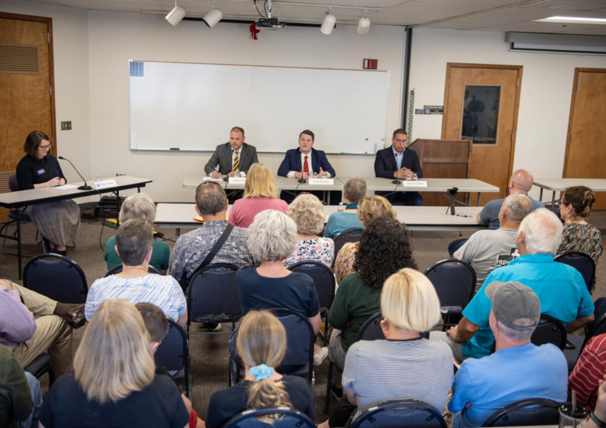 A crowd listens to candidates for the 18th Legislative District Senate seat Monday during a Clark County League of Women Voters forum at Clark-Cowlitz Fire Rescue Station 26.