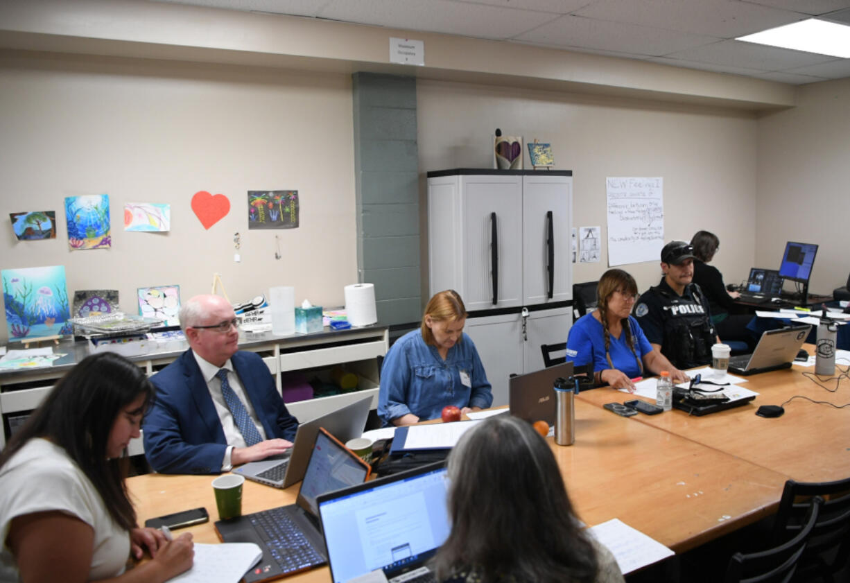 Clark County Community Court members listen to a participant July 1 at Recovery Cafe. Almost half of those participating in the court have graduated since it launched in April 2023..