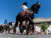 Horseback riders participate in the Fourth of July parade Thursday in Ridgefield.
