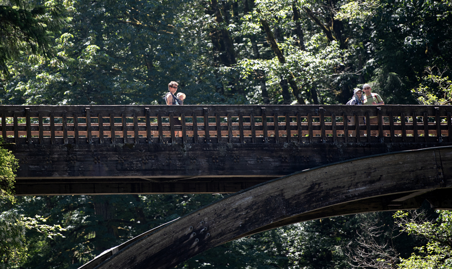 Visitors to Moulton Falls Bridge pause to check out the view Friday afternoon. The bridge will close next week for repairs.