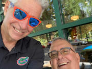 Columbian editor emeritus Lou Brancaccio, left, and current editor Craig Brown catch up at the Eighth Street Starbucks Coffee in downtown Vancouver on Wednesday.