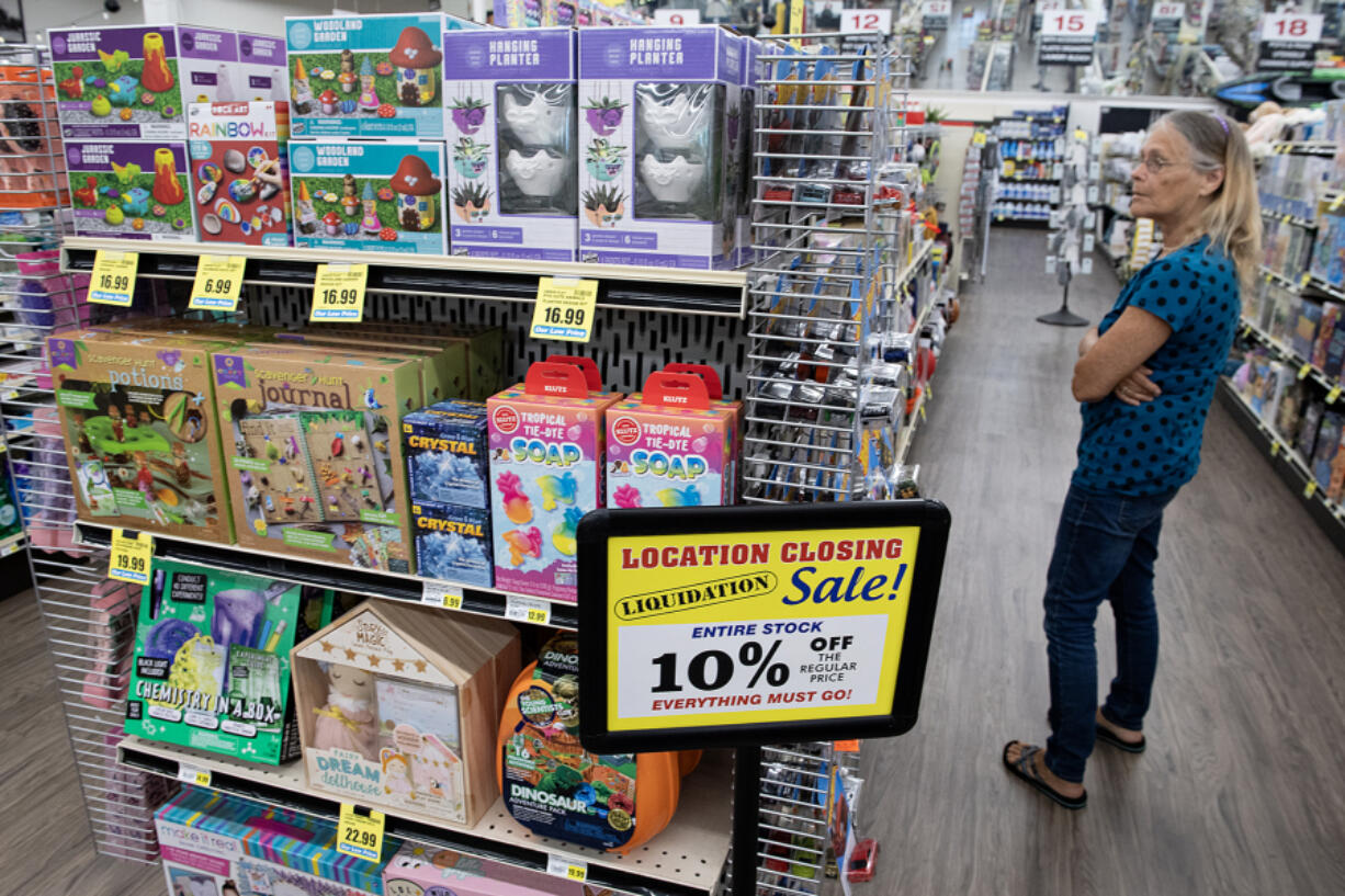 Laura Bonacorsi of Vancouver looks over the selection of merchandise while shopping at Hi-School Marketplace &amp; Hardware on Thursday afternoon. The Minnehaha store is expected to cease operations by the end of the year.