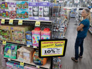 Laura Bonacorsi of Vancouver looks over the selection of merchandise while shopping at Hi-School Marketplace &amp; Hardware on Thursday afternoon. The Minnehaha store is expected to cease operations by the end of the year.