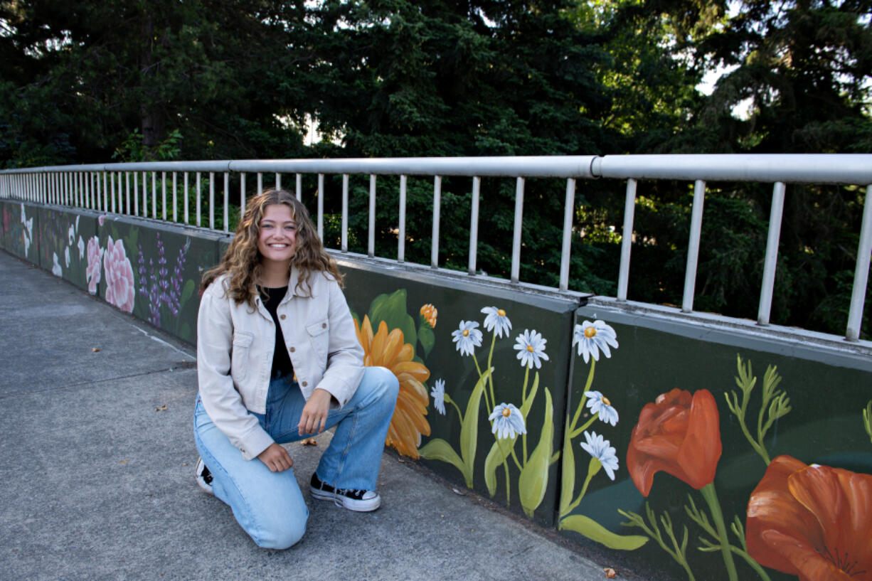 LEADOPTION Artist Ana Honsowetz painted a 600-foot mural on Evergreen Boulevard overlooking Interstate 5.