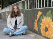 Artist Ana Honsowetz painted a 600-foot mural on Evergreen Boulevard overlooking Interstate 5.