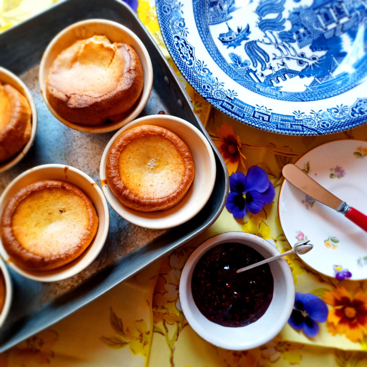 Popovers and Yorkshire puddings are essentially the same thing, except Yorkshire puddings are traditionally cooked in roast beef drippings.