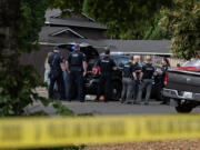 First responders work at the scene after a shooting left two people dead in central Vancouver on Thursday morning, July 25, 2024.