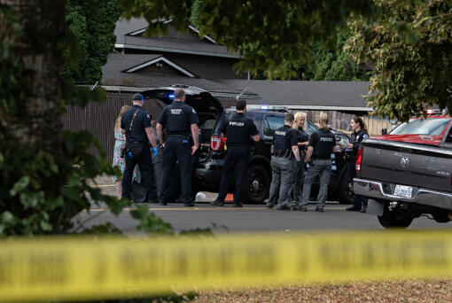First responders work at the scene after a shooting left two people dead in central Vancouver on Thursday morning, July 25, 2024.
