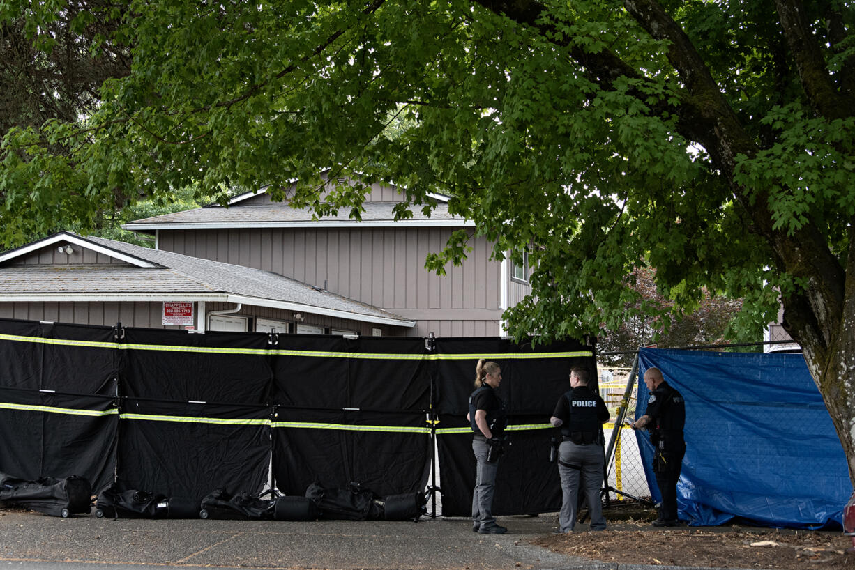 First responders work at the scene after a shooting left two people dead in central Vancouver on Thursday morning, July 25, 2024.