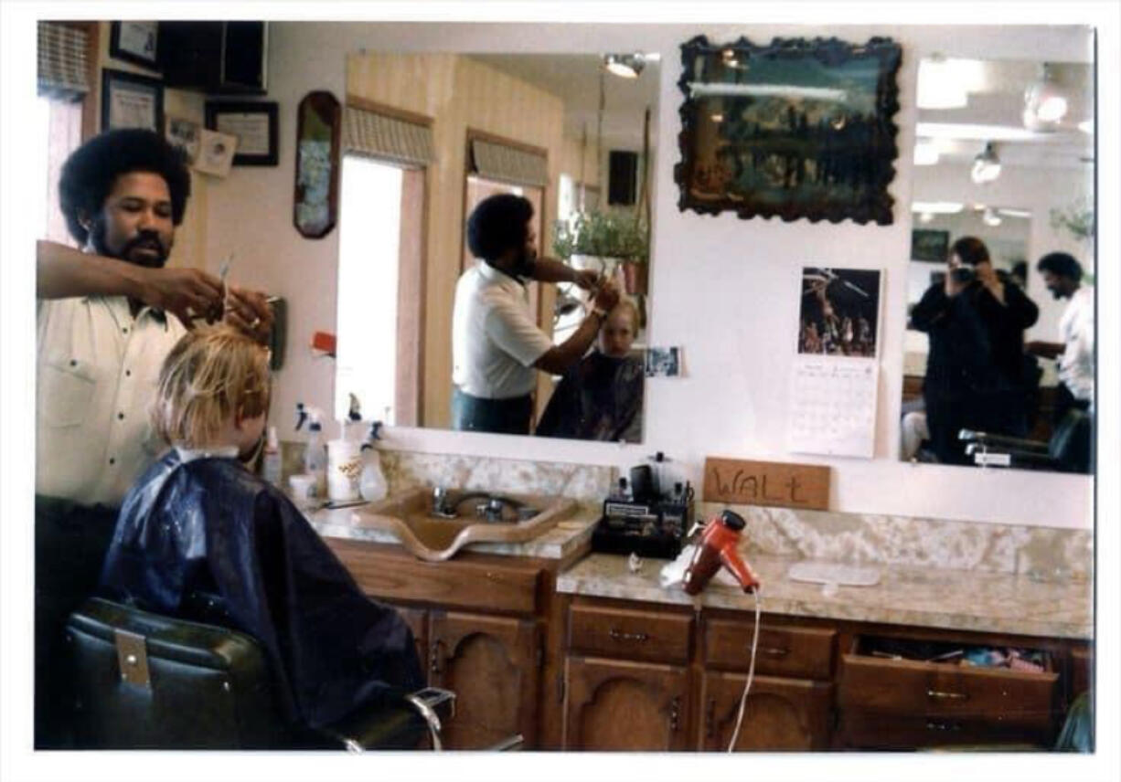 Walter Smith cuts hair in his shop.