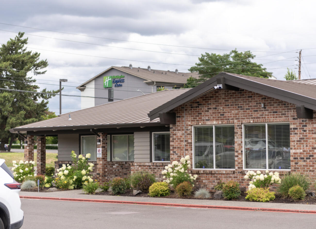 A Holiday Inn Express and Suites rises above NorthStar Clinic. After initial pushback from neighbors, some surrounding businesses say they haven&rsquo;t experienced problems related to the clinic.