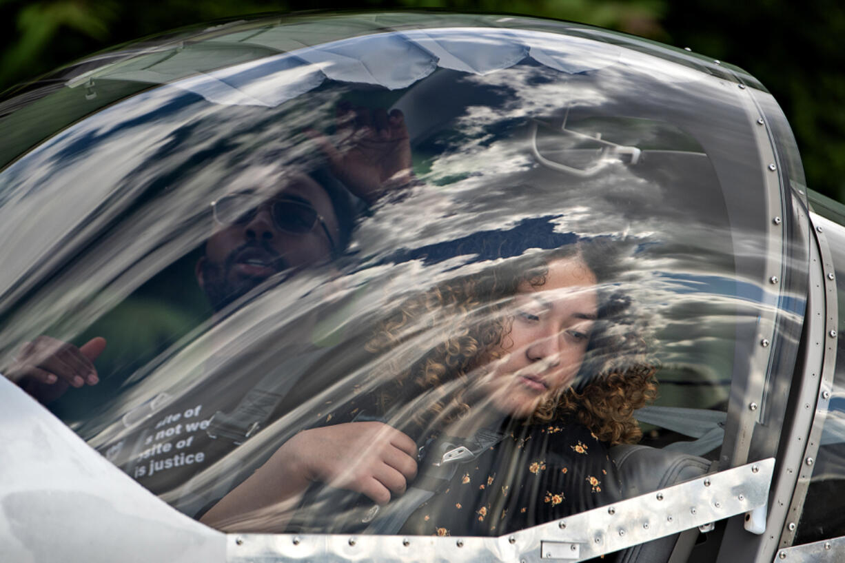 Jaylen Palmer, an Air Force Academy cadet and Airway Science for Kids chief pilot, left, prepares for a flight with student Erika Higuera on Tuesday morning at the Pearson Field Education Center. Airway Science for Kids Inc. works with Clark County youth to provide historically excluded students an opportunity to learn about aviation. This summer, 12 students are participating in the summer aviation camp.