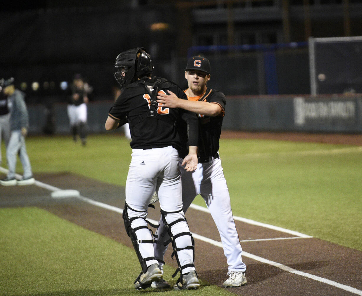 Cowlitz Black Bears pitcher Michael LeJeune (right) celebrates with catcher Ben Adams after the Black Bears beat the Ridgefield Raptors 6-5 in a West Coast League baseball game at David Story Field in Longview on Friday, July 26, 2024.