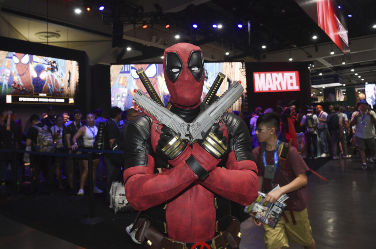 Jesus Rodriquez dressed as Deadpool poses at Comic-Con International on Thursday, July 25, 2024, in San Diego.