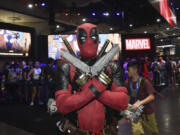 Jesus Rodriquez dressed as Deadpool poses at Comic-Con International on Thursday, July 25, 2024, in San Diego.