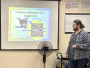 In this undated photo, Richie Hull, a lead instructor at the Connecticut-based group CfAL for Digital Inclusion, teaches the Foundation to a Career in Computers class at the organization&rsquo;s computer lab in New Haven, Conn. States are looking to beef up their residents tech skills as generative artificial intelligence plays a greater role in the workplace. CfAL officials, however, say basic computer skills are also still needed.