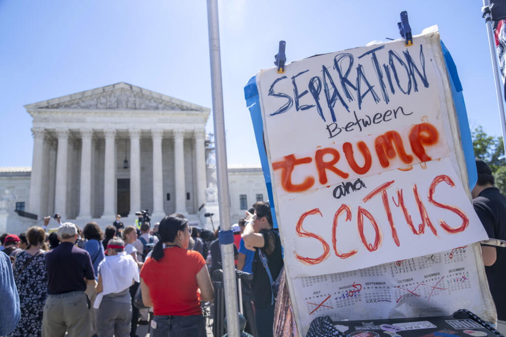 People protest, Monday, July 1, 2024, outside the Supreme Court in Washington, as decisions are announced.