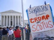 People protest, Monday, July 1, 2024, outside the Supreme Court in Washington, as decisions are announced.