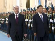 In this photo released by Kazakhstan's Presidential Press Office, President Kassym-Jomart Tokayev, left, and Chinese President Xi Jinping attend an official welcome ceremony at the palace in Astana, Kazakhstan, Wednesday, July 3, 2024.