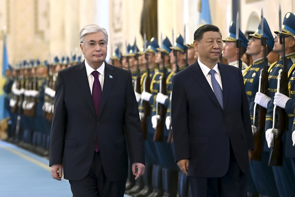 In this photo released by Kazakhstan's Presidential Press Office, President Kassym-Jomart Tokayev, left, and Chinese President Xi Jinping attend an official welcome ceremony at the palace in Astana, Kazakhstan, Wednesday, July 3, 2024.