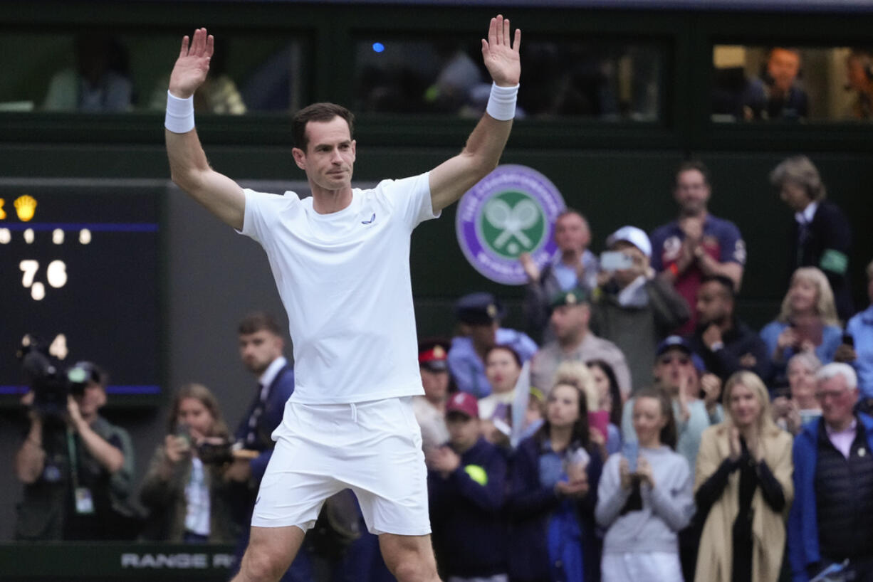 Britain's Andy Murray waves to the Center Court crowd as he leaves following his first round doubles loss at the Wimbledon tennis championships in London, Thursday, July 4, 2024.