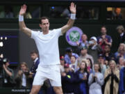 Britain's Andy Murray waves to the Center Court crowd as he leaves following his first round doubles loss at the Wimbledon tennis championships in London, Thursday, July 4, 2024.