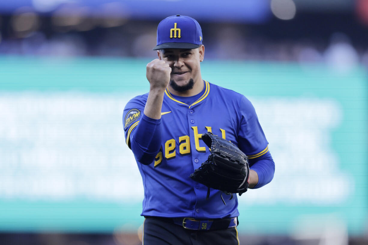Seattle Mariners starting pitcher Luis Castillo pumps his fist after striking out Toronto Blue Jays' Vladimir Guerrero Jr. during the first inning in a baseball game, Friday, July 5, 2024, in Seattle.