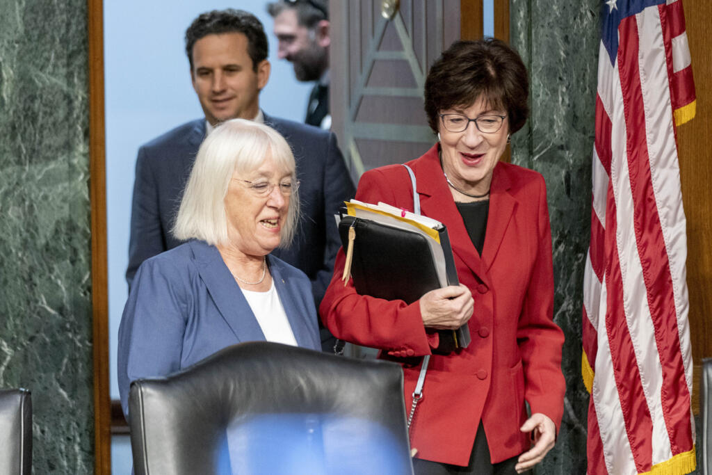 FILE - Chair Sen. Patty Murray, D-Wash., left, and Vice Chair Sen. Susan Collins, R-Maine, right, arrives for a Senate Appropriations hearing, on Capitol Hill in Washington, May 16, 2023. The Senate will pursue a spending increase next year of about 3.4% for defense and 2.7% increase for non-defense programs under a bipartisan agreement reached by the Senate Appropriations Committee. The deal reached by Sens. Patty Murray and Susan Collins sets up a certain clash later this year with the House, which is pursuing less spending in both categories.