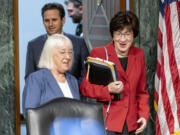 FILE - Chair Sen. Patty Murray, D-Wash., left, and Vice Chair Sen. Susan Collins, R-Maine, right, arrives for a Senate Appropriations hearing, on Capitol Hill in Washington, May 16, 2023. The Senate will pursue a spending increase next year of about 3.4% for defense and 2.7% increase for non-defense programs under a bipartisan agreement reached by the Senate Appropriations Committee. The deal reached by Sens. Patty Murray and Susan Collins sets up a certain clash later this year with the House, which is pursuing less spending in both categories.