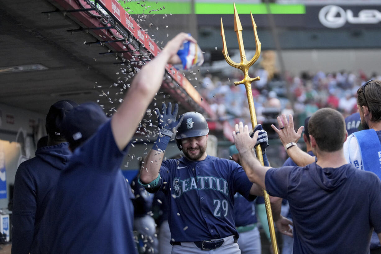 Seattle Mariners' Cal Raleigh (29) celebrates after hitting a home run during the third inning of a baseball game against the Los Angeles Angels in Anaheim, Calif., Thursday, July 11, 2024.