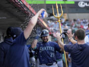 Seattle Mariners' Cal Raleigh (29) celebrates after hitting a home run during the third inning of a baseball game against the Los Angeles Angels in Anaheim, Calif., Thursday, July 11, 2024.