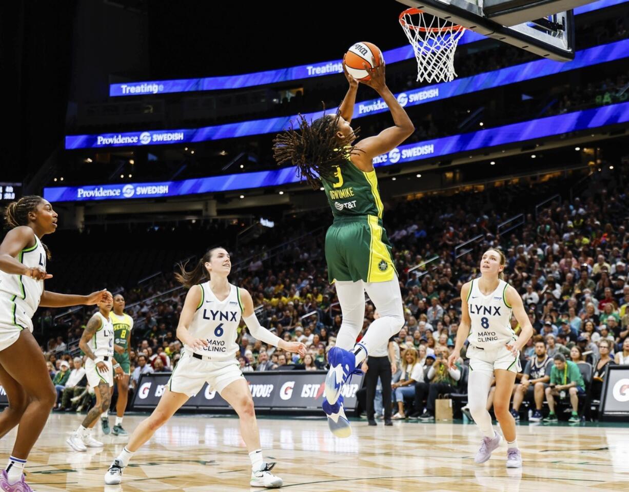 Seattle Storm's Nneka Ogwumike scores against Minnesota Lynx in the second quarter during a WNBA Basketball on Friday, July 12, 2024 at Climate Pledge Arena, in Seattle, (Dean Rutz/The Seattle Times via AP)