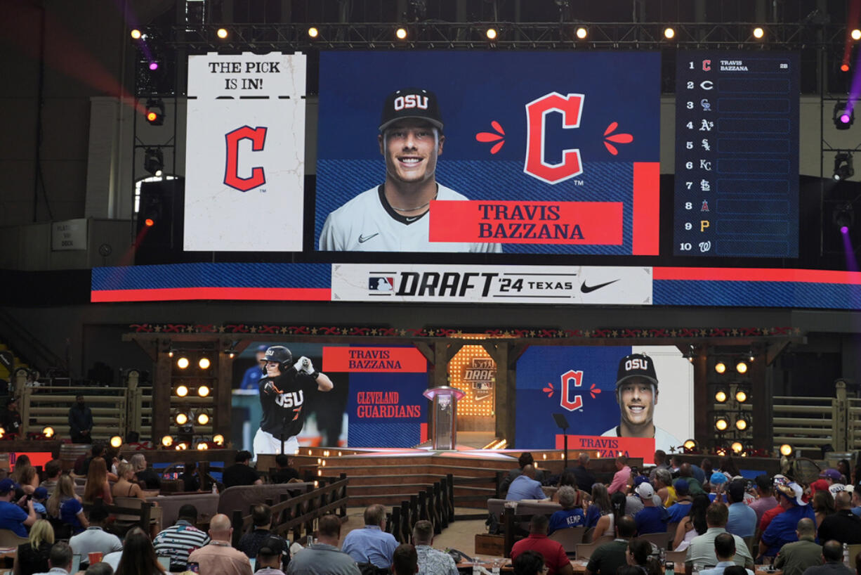 An image of Travis Bazzana is shown on the video board after the Cleveland Guardians selected Bazzana, the first overall pick in the MLB baseball draft, in Fort Worth, Texas, Sunday, July 14, 2024.