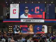 An image of Travis Bazzana is shown on the video board after the Cleveland Guardians selected Bazzana, the first overall pick in the MLB baseball draft, in Fort Worth, Texas, Sunday, July 14, 2024.